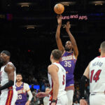 Nov 6, 2024; Phoenix, Arizona, USA; Phoenix Suns forward Kevin Durant (35) shoots against the Miami Heat during the first half at Footprint Center. Mandatory Credit: Joe Camporeale-Imagn Images