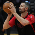 Dec 7, 2024; Miami, Florida, USA; Miami Heat forward Kevin Love (42) warms-up before a game against the Phoenix Suns at Kaseya Center.