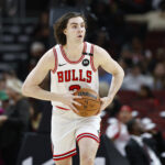 Dec 8, 2024; Chicago, Illinois, USA; Chicago Bulls guard Josh Giddey (3) looks to pass the ball against the Philadelphia 76ers during the first half at United Center.