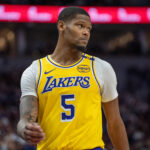 Dec 13, 2024; Minneapolis, Minnesota, USA; Los Angeles Lakers forward Cam Reddish (5) enters the court after a timeout in the second quarter against the Minnesota Timberwolves at Target Center. Mandatory Credit: Matt Blewett-Imagn Images