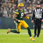 Dec 23, 2024; Green Bay, Wisconsin, USA; Green Bay Packers wide receiver Christian Watson (9) rushes with the football during the second quarter against the New Orleans Saints at Lambeau Field. Mandatory Credit: Jeff Hanisch-Imagn Images