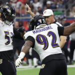 Dec 25, 2024; Houston, Texas, USA; Baltimore Ravens defensive tackle Nnamdi Madubuike (92) celebrates linebacker Kyle Van Noy (53) sack against Houston Texans quarterback C.J. Stroud (7) (not pictured) in the first quarter at NRG Stadium. Mandatory Credit: Thomas Shea-Imagn Images