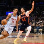 Dec 30, 2024; Washington, District of Columbia, USA; Washington Wizards guard Malcolm Brogdon (15) drives to the basket as New York Knicks guard Landry Shamet (44) defends during the third quarter at Capital One Arena.