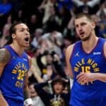 Nikola Jokic Aaron Gordon Jan 23, 2025; Denver, Colorado, USA; Denver Nuggets center Nikola Jokic (15) reacts along side forward Aaron Gordon (32) following a full court basket made in the second half against the Sacramento Kings at Ball Arena. Mandatory Credit: Ron Chenoy-Imagn Images