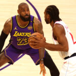 Feb 28, 2025; Los Angeles, California, USA; Los Angeles Lakers forward LeBron James (23) defends LA Clippers forward Kawhi Leonard (2) during the first quarter at Crypto.com Arena. Mandatory Credit: Jason Parkhurst-Imagn Images