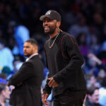 Mar 24, 2025; Brooklyn, New York, USA; Dallas Mavericks guard Kyrie Irving (11) looks on during the first quarter against the Brooklyn Nets at Barclays Center.