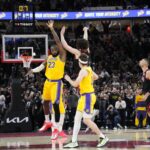 Mar 27, 2025; Chicago, Illinois, USA; Chicago Bulls guard Josh Giddey (3) makes the game winning three point basket as Los Angeles Lakers forward LeBron James (23) defends him during the second half at United Center.