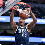Apr 2, 2025; Dallas, Texas, USA; Dallas Mavericks forward Kai Jones (23) dunks against the Atlanta Hawks during the first half at American Airlines Center. Mandatory Credit: Kevin Jairaj-Imagn Images