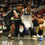 Apr 3, 2025; Brooklyn, New York, USA; Minnesota Timberwolves shooting guard Anthony Edwards (5) dribbles the ball past Brooklyn Nets guard Keon Johnson (45) during the second half at Barclays Center.