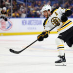 Apr 6, 2025; Buffalo, New York, USA; Boston Bruins right wing David Pastrnak (88) takes a shot on goal during the third period against the Buffalo Sabres at KeyBank Center. Mandatory Credit: Timothy T. Ludwig-Imagn Images