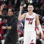 Apr 16, 2025; Chicago, Illinois, USA; Miami Heat guard Tyler Herro (14) and head coach Erik Spoelstra ask for a replay against the Chicago Bulls during the second half at United Center. Mandatory Credit: David Banks-Imagn Images