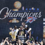 Jun 24, 2025; Oklahoma City, OK, USA; Oklahoma City Thunder forward Jalen Williams, left, Oklahoma City Thunder center Isaiah Hartenstein, back, and Oklahoma City Thunder forward Jaylin Williams, right, gather around Oklahoma City Mayor David Holt during the Oklahoma City Thunder Champions parade closing ceremony at Scissortail Park.