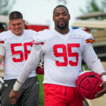 Jul 22, 2025; St. Joseph, MO, USA; Kansas City Chiefs defensive end George Karlaftis (56) and defensive tackle Chris Jones (95) walk down the hill to the practice fields during training camp at Missouri Western State University.