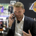 Aug 2, 2025; El Segundo, CA, USA; Los Angeles Lakers Luka Doncic (77) is interviewed by ESPN LA radio following a press conference announcing the signing of a 3-year, $165 million contract extension at UCLA Health Training Center. Mandatory Credit: Jayne Kamin-Oncea-Imagn Images