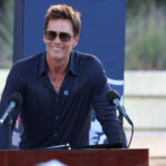 Aug 8, 2025; Foxborough, Massachusetts, USA; Retired New England Patriot Hall of Famer Tom Brady speaks during a statue unveiling before a game against the Washington Commanders at Gillette Stadium. Mandatory Credit: Paul Rutherford-Imagn Images