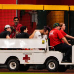 Sep 1, 2025; Phoenix, Arizona, USA; Arizona Diamondbacks outfielder Lourdes Gurriel Jr. (12) is taken off by cart after a collision in the outfield in the sixth inning during the game between the Texas Rangers and Arizona Diamondbacks at Chase Field. Mandatory Credit: Arianna Grainey-Imagn Images