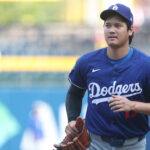 Sep 2, 2025; Pittsburgh, Pennsylvania, USA; Los Angeles Dodgers two-way player Shohei Ohtani (17) jogs in from the outfield before the game against the Pittsburgh Pirates at PNC Park. Mandatory Credit: Charles LeClaire-Imagn Images