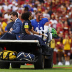 Sep 7, 2025; Landover, Maryland, USA; New York Giants linebacker Micah McFadden (41) is carted off the field during the first quarter against the Washington Commanders at Northwest Stadium. Mandatory Credit: Peter Casey-Imagn Images