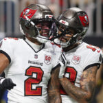 Sep 7, 2025; Atlanta, Georgia, USA; Tampa Bay Buccaneers wide receiver Emeka Egbuka (2) celebrates with wide receiver Mike Evans (13) after scoring a touchdown against the Atlanta Falcons during the second quarter at Mercedes-Benz Stadium. Mandatory Credit: Brett Davis-Imagn Images
