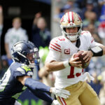 Sep 7, 2025; Seattle, Washington, USA; San Francisco 49ers quarterback Brock Purdy (13) runs the ball during the first half against the Seattle Seahawks at Lumen Field. Mandatory