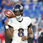 Sep 7, 2025; Orchard Park, New York, USA; Baltimore Ravens quarterback Lamar Jackson (8) warms up prior to the game against the Buffalo Bills at Highmark Stadium. Mandatory Credit: Mark Konezny-Imagn Images