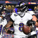 Sep 7, 2025; Orchard Park, New York, USA; Baltimore Ravens quarterback Lamar Jackson (8) celebrates with wide receiver Tylan Wallace (16) after a touchdown against the Buffalo Bills during the first half at Highmark Stadium. Mandatory Credit: Mark Konezny-Imagn Images