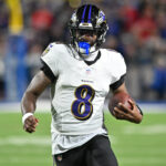 Sep 7, 2025; Orchard Park, New York, USA; Baltimore Ravens quarterback Lamar Jackson (8) runs with the ball against the Buffalo Bills during the second quarter at Highmark Stadium. Mandatory Credit: Mark Konezny-Imagn Images