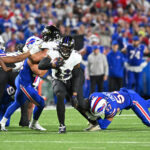 Sep 7, 2025; Orchard Park, New York, USA; Baltimore Ravens running back Derrick Henry (22) runs with the ball against the Buffalo Bills during the second quarter at Highmark Stadium. Mandatory Credit: Mark Konezny-Imagn Images