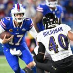 Sep 7, 2025; Orchard Park, New York, USA; Buffalo Bills quarterback Josh Allen (17) runs the ball defended by Baltimore Ravens linebacker Teddye Buchanan (40) during the third quarter at Highmark Stadium.