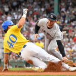 Sep 13, 2025; Boston, Massachusetts, USA; New York Yankees third baseman Ryan McMahon (19) tags Boston Red Sox right fielder Nate Eaton (40) out at third base during the second inning at Fenway Park. Mandatory Credit: Eric Canha-Imagn Images