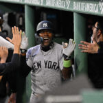 Sep 13, 2025; Boston, Massachusetts, USA; New York Yankees second baseman Jazz Chisholm Jr. (13) celebrates his one run home run in the dugout during fifth inning inning against the Boston Red Sox at Fenway Park.