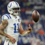 Sep 14, 2025; Indianapolis, Indiana, USA; Indianapolis Colts wide receiver Michael Pittman Jr. (11) warms up before the game against the Denver Broncos at Lucas Oil Stadium. Mandatory Credit: Christine Tannous-USA TODAY Network via Imagn Images
