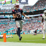 Sep 14, 2025; Miami Gardens, Florida, USA; New England Patriots quarterback Drake Maye (10) runs into the endzone for a touchdown against the Miami Dolphins in the third quarter at Hard Rock Stadium.