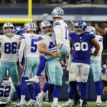 Sep 14, 2025; Arlington, Texas, USA; Dallas Cowboys long snapper Trent Sieg (44) lifts up place kicker Brandon Aubrey (17) after his game-winning field goal against the New York Giants during overtime at AT&T Stadium