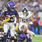 Sep 14, 2025; Minneapolis, Minnesota, USA; Minnesota Vikings running back Aaron Jones Sr. (33) runs the ball during the first half against the Atlanta Falcons at U.S. Bank Stadium. Mandatory Credit: Jeffrey Becker-Imagn Images