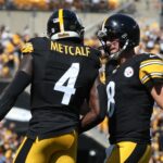 Sep 14, 2025; Pittsburgh, Pennsylvania, USA; Pittsburgh Steelers wide receiver DK Metcalf (4) and quarterback Aaron Rodgers (8) celebrate after combining for a touchdown against the Seattle Seahawks during the second quarter at Acrisure Stadium.