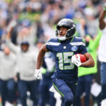 Sep 21, 2025; Seattle, Washington, USA; Seattle Seahawks wide receiver Tory Horton (15) makes a 95 yard punt return for a touchdown during the first quarter against the New Orleans Saints at Lumen Field. Mandatory Credit: Steven Bisig-Imagn Images