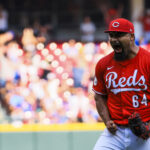 Sep 21, 2025; Cincinnati, Ohio, USA; Cincinnati Reds relief pitcher Tony Santillan (64) reacts after the victory over the Chicago Cubs at Great American Ball Park. Mandatory Credit: Katie Stratman-Imagn Images