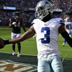Sep 21, 2025; Chicago, Illinois, USA; Dallas Cowboys wide receiver George Pickens (3) reacts after scoring a touchdown against the Chicago Bears during the first half at Soldier Field. Mandatory Credit: Matt Marton-Imagn Images