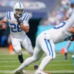 Indianapolis Colts running back Jonathan Taylor (28) looks for daylight through the Tennessee Titans defense during the third quarter at Nissan Stadium in Nashville, Tenn.,Sunday, Sept. 21, 2025.