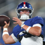 Sep 21, 2025; East Rutherford, New Jersey, USA; New York Giants quarterback Jaxson Dart (6) warms up before the game against the Kansas City Chiefs at MetLife Stadium. Mandatory Credit: Vincent Carchietta-Imagn Images
