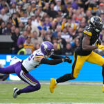 Sep 28, 2025; Dublin, Ireland; Pittsburgh Steelers wide receiver Dk Metcalf (4) runs for a gain past Minnesota Vikings cornerback Kahlef Hailassie (25) during the first quarter during an NFL International Series game at Croke Park. Mandatory Credit: Kirby Lee-Imagn Images