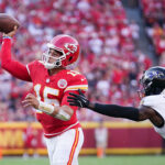 Sep 28, 2025; Kansas City, Missouri, USA; Kansas City Chiefs quarterback Patrick Mahomes (15) makes a pass as Baltimore Ravens cornerback Chidobe Awuzie (3) defends at GEHA Field at Arrowhead Stadium.