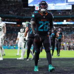Sep 29, 2025; Miami Gardens, Florida, USA; Miami Dolphins running back De'von Achane (28) reacts after rushing for a touchdown against the New York Jets during the second half at Hard Rock Stadium