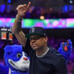 Mar 10, 2022; Philadelphia, Pennsylvania, USA; Former Philadelphia 76ers player Allen Iverson acknowledges the crowd during the game against the Brooklyn Nets during the second quarter at Wells Fargo Center.