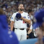 Sep 19, 2025; Los Angeles, California, USA; Los Angeles Dodgers pitcher Clayton Kershaw (22) salutes the crowd after being relieved during the fifth inning against the San Francisco Giants at Dodger Stadium.