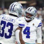 Sep 14, 2025; Arlington, Texas, USA; Dallas Cowboys running back Javonte Williams (33) celebrates with quarterback Dak Prescott (4) after scoring a touchdown against the New York Giants during the third quarter at AT&T Stadium.
