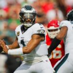 Sep 14, 2025; Kansas City, Missouri, USA; Philadelphia Eagles quarterback Jalen Hurts (1) throws a pass during the first half against the Kansas City Chiefs at GEHA Field at Arrowhead Stadium.