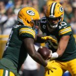 Sep 7, 2025; Green Bay, Wisconsin, USA; Green Bay Packers quarterback Jordan Love (10) hand soff the ball to Green Bay Packers running back Josh Jacobs (8) against the Detroit Lions during the first quarter at Lambeau Field.
