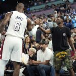 Aug 8, 2024; Paris, France; United States guard LeBron James (6) shakes hands with son Bryce James against Serbia in a men's basketball semifinal game during the Paris 2024 Olympic Summer Games at Accor Arena.